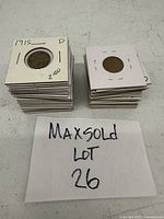 Stacks of individually sleeved Lincoln wheat pennies including clearly visible 1915-D and 1919-S dated coins.