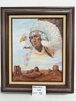 Full view of framed Native American themed painting with eagle and western landscape.