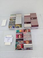 Plastic containers holding multiple stacks of Star Trek trading cards, arranged neatly showing character images on selected cards.