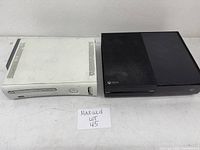 Both Xbox 360 consoles side by side showing overall condition and size comparison