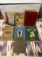 Front covers of 8 antique classic books showing various titles with detailed artwork and classic designs.