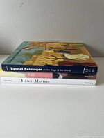 Stack of three art books titled Lyonel Feininger, Art, and Henri Matisse