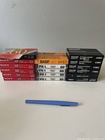17 sealed blank audio cassette tapes from brands Sony, BASF, ProTek, Maxell. Packaged in original sealed plastic with visible branding and tape lengths.