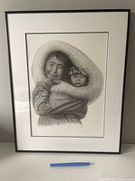 Frontal view of the framed charcoal drawing showing the entire artwork.