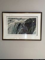 Full view of framed print hanging on wall