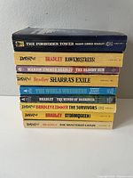 Stack of 9 Marion Zimmer Bradley paperback books, showing spine titles.