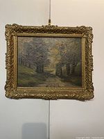 Overall front view of the oil painting with ornate gilded frame