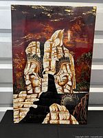 Full view of the cracked painted style artwork showing two Chinese statue busts facing away on a red and black background with stone-like texture.