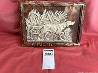 Closed mahogany valet box with inlay depicting a Golden Retriever hunting dog in a foliage setting on the lid.