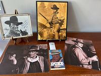 Overall lot display with framed autograph, 3 large prints, and book 'Duke: The Real John Wayne'
