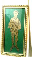 Full view photo of framed brass rubbing depicting Sir Thomas Peyton in medieval armor