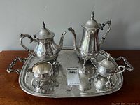 Full view of the complete silver-plated tea and coffee set on the tray