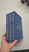 Spine view of the three John G. Diefenbaker books titled 'One Canada' in blue cloth covers with gold lettering.