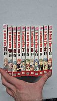 Front spines of La Corda d'Oro manga volumes 1-11, showing consecutive numbering and character illustrations on the spines.