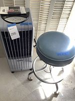 Symphony air cooler and rolling stool side by side, showing overall size and condition