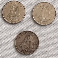 Obverse side of three Canadian 10 cent coins dated 1980, 1981, and 1983 featuring the Bluenose schooner.