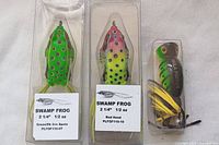 Two Swamp Frog fishing lures in packaging showing size and weight information.