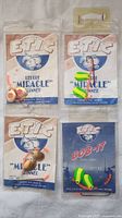 Four Etic fishing accessories including three Miracle Spinner lures and one Bob-It lure in original packaging.