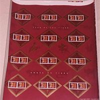 Photo showing one uncut Year of the Tiger stamp sheet on red background with multiple stamps and text