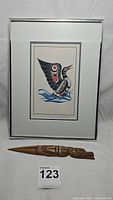 Framed "Loon Dance" print with wooden wolf totem letter opener set below it, showing full lot.