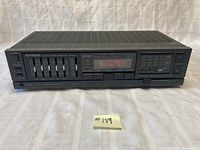 Front view of Kenwood KR-A20 stereo receiver showing the full front panel with power, speaker selector A/B, headphone jack, graphic equalizer sliders and balance control.