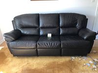 Front view of three-seat leather sofa