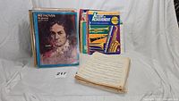 Photo showing a stack of various vintage sheet music including Beethoven and an instructional brass instrument book.