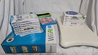 Overview of Wii Fit U bundle box with game cases and digital Fit Meter on top