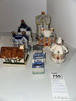 Overview of all seven ceramic pieces grouped on white background