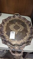 Full view of large ornate electroplated tray showing tarnished surface and elaborate border design with handles.