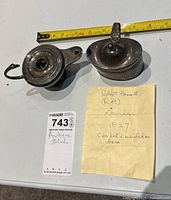 Sterling silver container and metal oil lamp with a yellow note describing the container as by Robert Hennell London 1827; containing sizing tape and label indicating item number and condition.