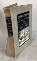 Front cover of the 1942 Currier & Ives book showing decorative patterned beige boards with black inset title and color print of horse-drawn sleigh in snow.