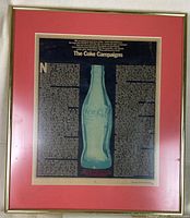 Full framed print displaying the Coca-Cola bottle and detailed text about the company's advertising campaigns.