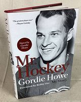Front cover of the hardcover book 'Mr. Hockey Gordie Howe My Story' showing Gordie Howe's photo, title, and signature sticker.