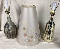 Front view of two pottery lamp bases and one pressed flower lampshade showing details and relative sizes.