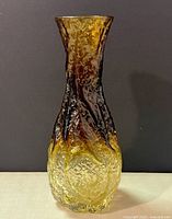 Front angle view of amber glass Mid-Century Modern vase with bark texture showing color gradients from amber to light amber.