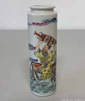 Front view of the vase showing the detailed hand painted imagery of a man holding a vessel above his head, waves and clouds around him
