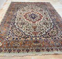 Full view of rug laid flat, showing overall condition and pattern