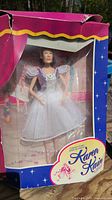 Original packaging showing Barbie Karen Kain ballet collectible figurine with stage backdrop scene in box