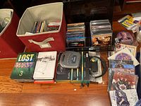 Initial overview of DVDs, CDs, and portable CD player.