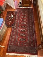 Runner and small mat side by side on hardwood floor