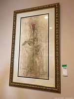 Full view of the framed wall art print showing red rose and ornate gold frame