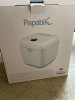 Front view of boxed Papabli UV Sterilizer and Dryer showing front design and branding.