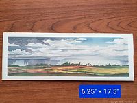 Full view of the unframed 'Scattered Showers' print showing the entire landscape composition and size indication.