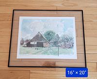 Framed watercolour painting showing a landscape with traditional thatched-roof houses, measuring 16 x 20 inches.
