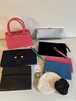 Photo shows all nine bags arranged on a surface, highlighting variety of styles and colors.