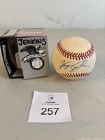 Signed baseball and box with auction number 257 visible