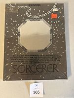 Front of sealed Infocom Sorcerer packaging with shrink wrap intact and lot tag visible