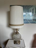 Full view of lamp with shade on table