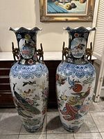 Pair of vases side by side showing full height and motifs